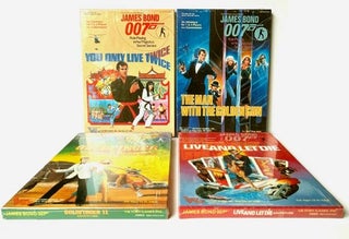Four official James Bond role-playing games, with accompanying book. Comprising; You Only Live Twice (1984, ISBN 0-912515-08-2), Live and Let Die (1984, ISBN 0-912515-09-0), Goldfinger II: The Man with the Midas Touch (1985, ISBN 0-912515-12-0), The Man with the Golden Gun (1985, ISBN 0-912515-13-9), Thrilling Locations (1985, book, ISBN 0-912515-10-4)